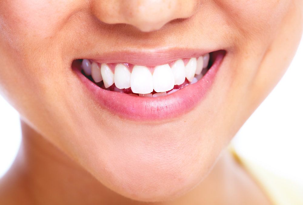 Close up of woman's very white teeth
