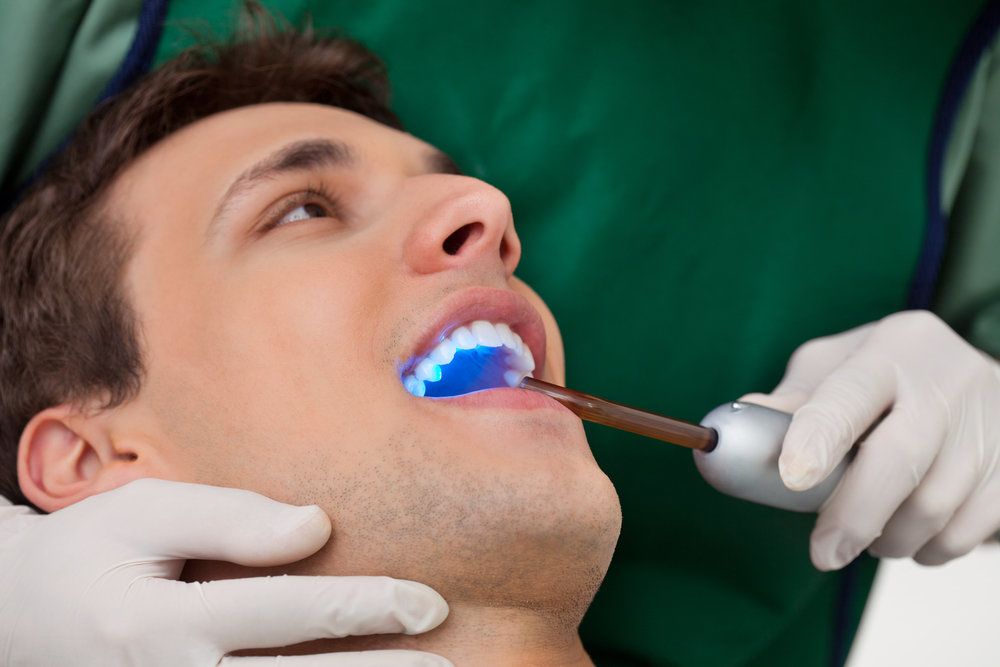 Man undergoing oral screening with advanced technology